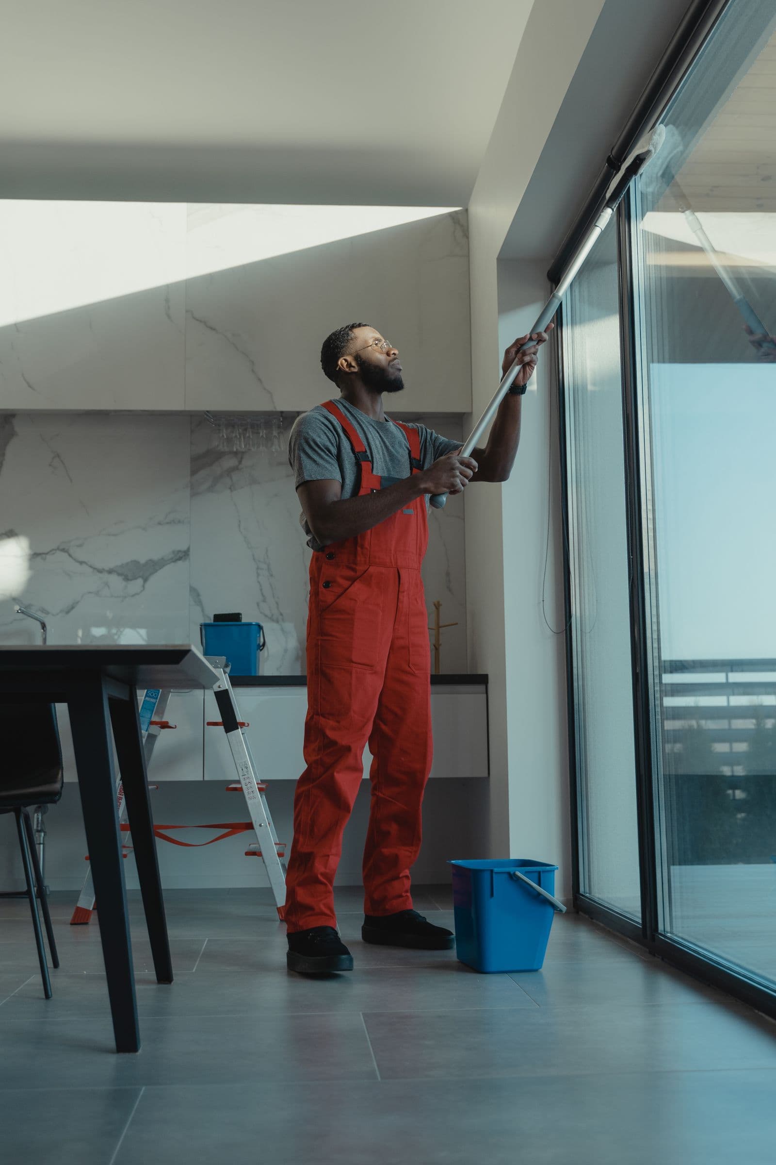 Water-fed pole cleaning a large exterior window